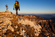 Young man with backpack on a mountain hike Young man with backpack on a mountain hike