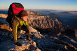 Young man with backpack on a mountain hike