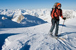 Young woman doing ski touring. Outdoor winter activity