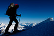 Silhouette of ski mountaineer in winter Alps