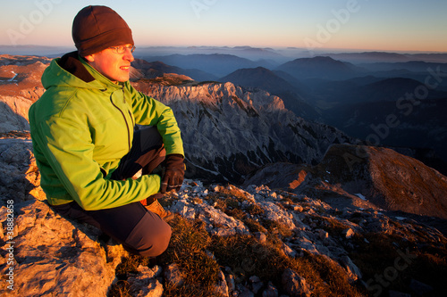 Photo: Young man enjoying autumn mountain sunset Young man enjoying autumn mountain sunset