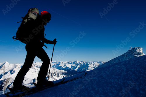 Photo: Silhouette of ski mountaineer in winter Alps Silhouette of ski mountaineer in winter Alps