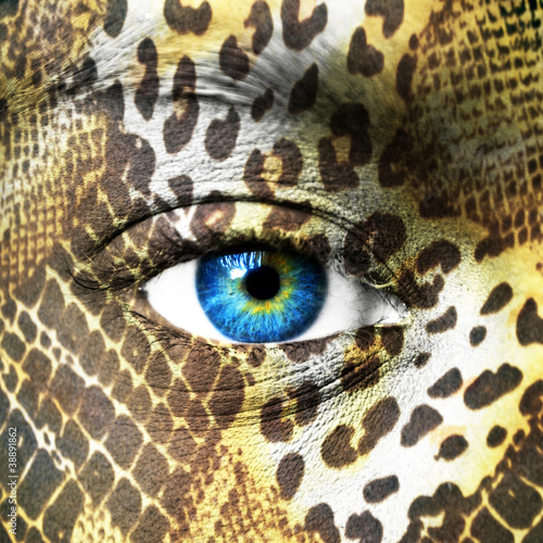 Photo: Human face with animal patterns Human face with animal patterns