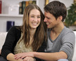 Photo: happy couple in living room happy couple in living room