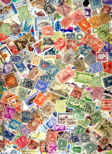 Photo: A pile of different postage stamps from around the world A pile of different postage stamps from around the world