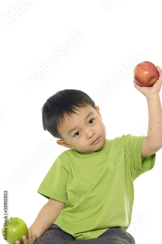 Photo: Boy holding an apple Boy holding an apple
