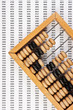 old wooden abacus on background working papers