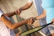 Shaking hands on tennis court Shaking hands on tennis court