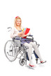 A smiling young girl in a wheelchair