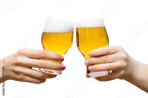Photo: Two arms with glasses of beer isolated on white Two arms with glasses of beer isolated on white
