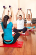 fitness group exercising with dumbbells