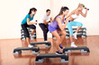 young people stepping with dumbbells young people stepping with dumbbells