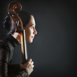 Inspired woman with cello. Cellist profile