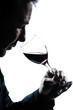 Photo: silhouette man portrait smelling red wine glass silhouette man portrait smelling red wine glass