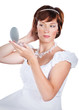 Photo: young bride doing makeup isolated on white background young bride doing makeup isolated on white background