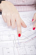 Photo: young adult businesswoman point on the plan young adult businesswoman point on the plan