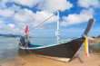 Foto: Long thai boat on sand beach Long thai boat on sand beach