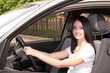 Photo: young brunette woman in new car young brunette woman in new car
