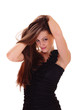 The woman in black dress straightens hair