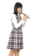 Young asian girl is playing on a flute
