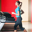 Gym exercising. Run on on a machine.
