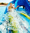 Child on water slide at aquapark.