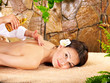 Woman getting massage in spa.