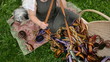 woven national strips in the woman hands