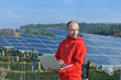 engineer using laptop at solar panels plant field engineer using laptop at solar panels plant field