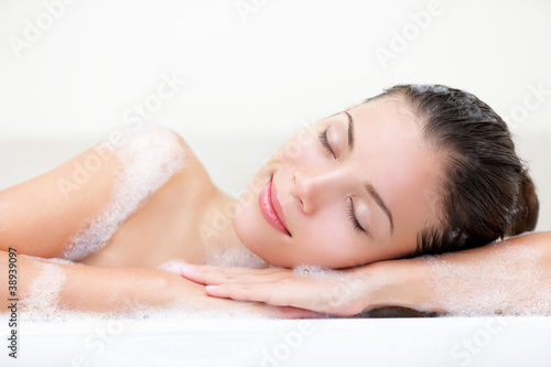 Photo: Woman relaxing in bath Woman relaxing in bath