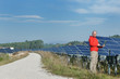 engineer using laptop at solar panels plant field engineer using laptop at solar panels plant field
