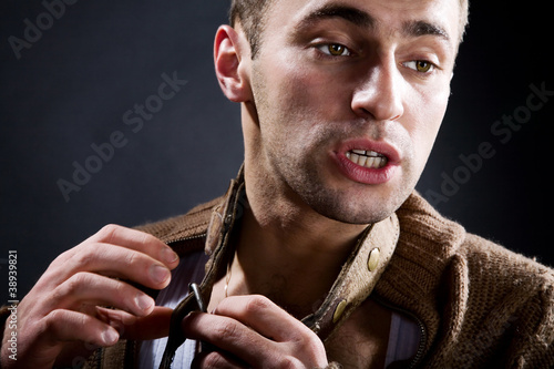 Photo: A young man with a dog collar A young man with a dog collar