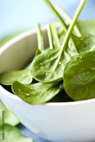 Photo: Closeup of fresh baby spinach in a bowl Closeup of fresh baby spinach in a bowl