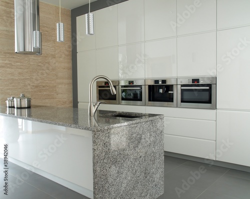Photo: Modern kitchen with travertine wall Modern kitchen with travertine wall