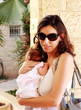 Foto: Fashionable young mother with her little baby Fashionable young mother with her little baby