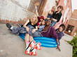Photo: Fun loving group of crazy teen punks sit in a blue inflateable p Fun loving group of crazy teen punks sit in a blue inflateable p