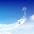 Paper plane against sky with clouds