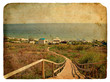 A staircase leads down to the sea. Old postcard.