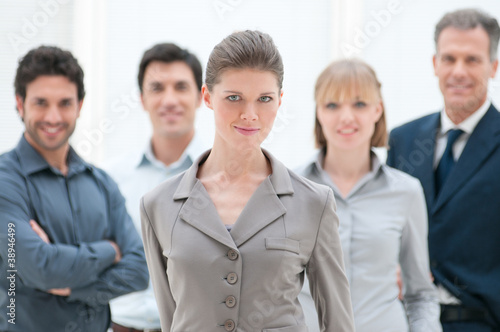 Photo: Proud businesswoman in group Proud businesswoman in group