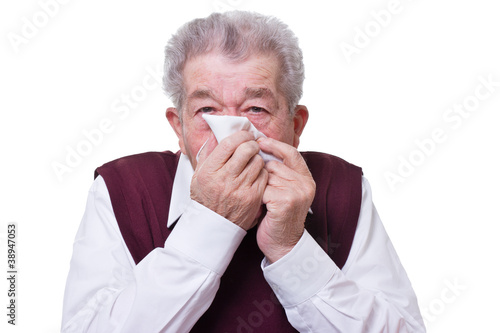 Photo: Senior putzt sich die Nase Senior putzt sich die Nase