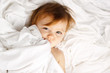 Photo: Beautiful child wrapped in white sheets Beautiful child wrapped in white sheets