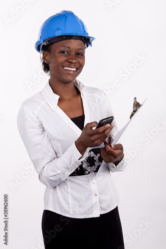 Photo: South African project manager dialing her phone South African project manager dialing her phone