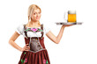 Photo: Woman in traditional costume holding a tray with beer glass Woman in traditional costume holding a tray with beer glass