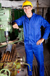 portrait of industrial machinist inside workshop