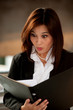 Shocked and surprised Thai businesswoman .