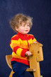 little child on a rocking horse little child on a rocking horse