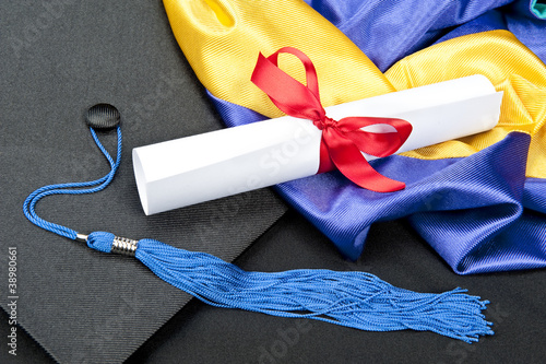 Photo: Graduation cap and diploma Graduation cap and diploma