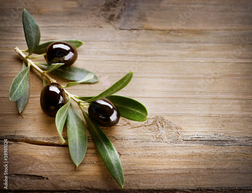 Photo: Olives on a Wood background Olives on a Wood background