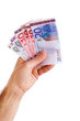 man hand whith euro bills, isolated on white