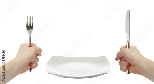 Photo: white square plate, knife and fork cutlery in hands isolated white square plate, knife and fork cutlery in hands isolated